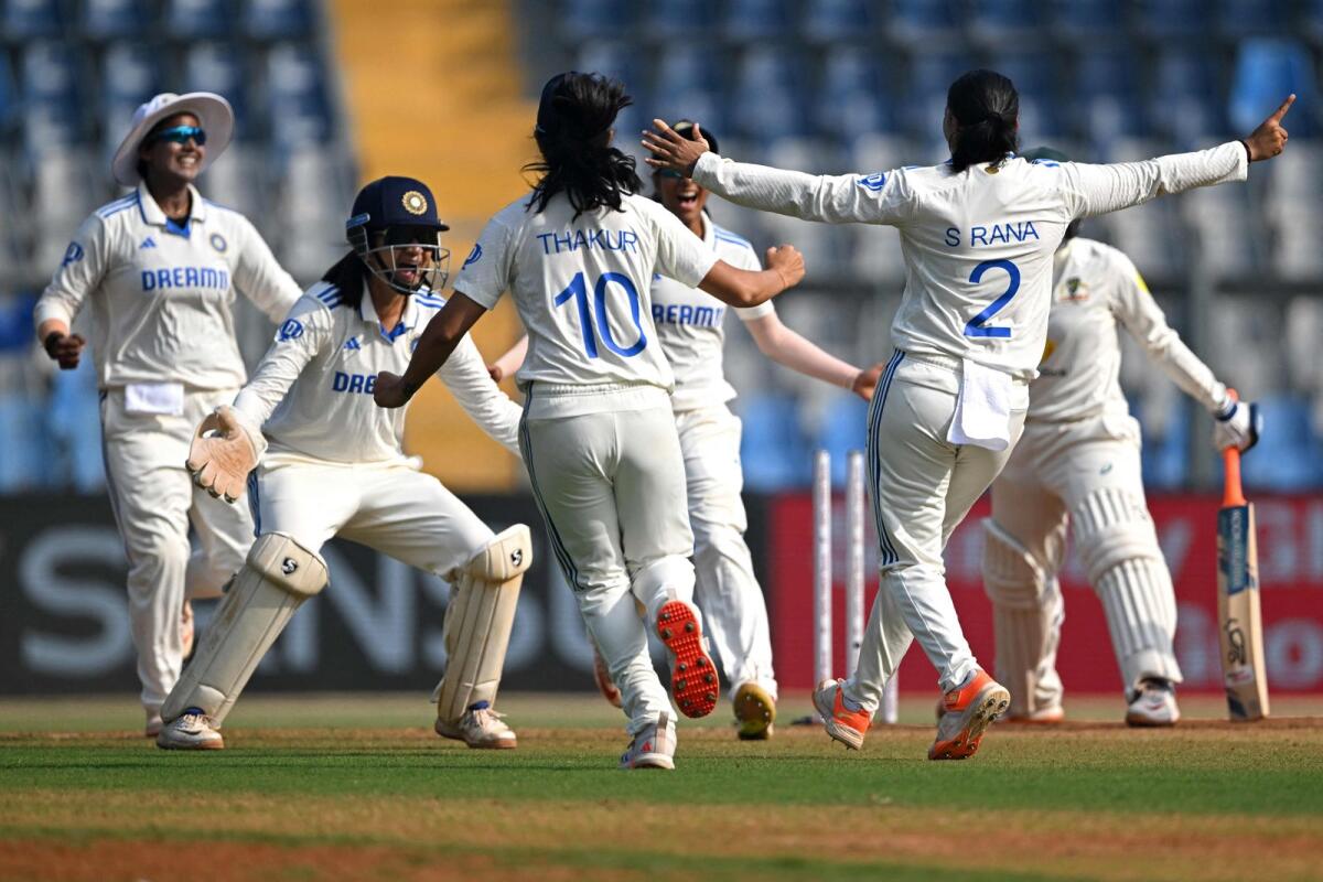 India's players celebrate after the dismissal of Australia's Alana King. — AFP