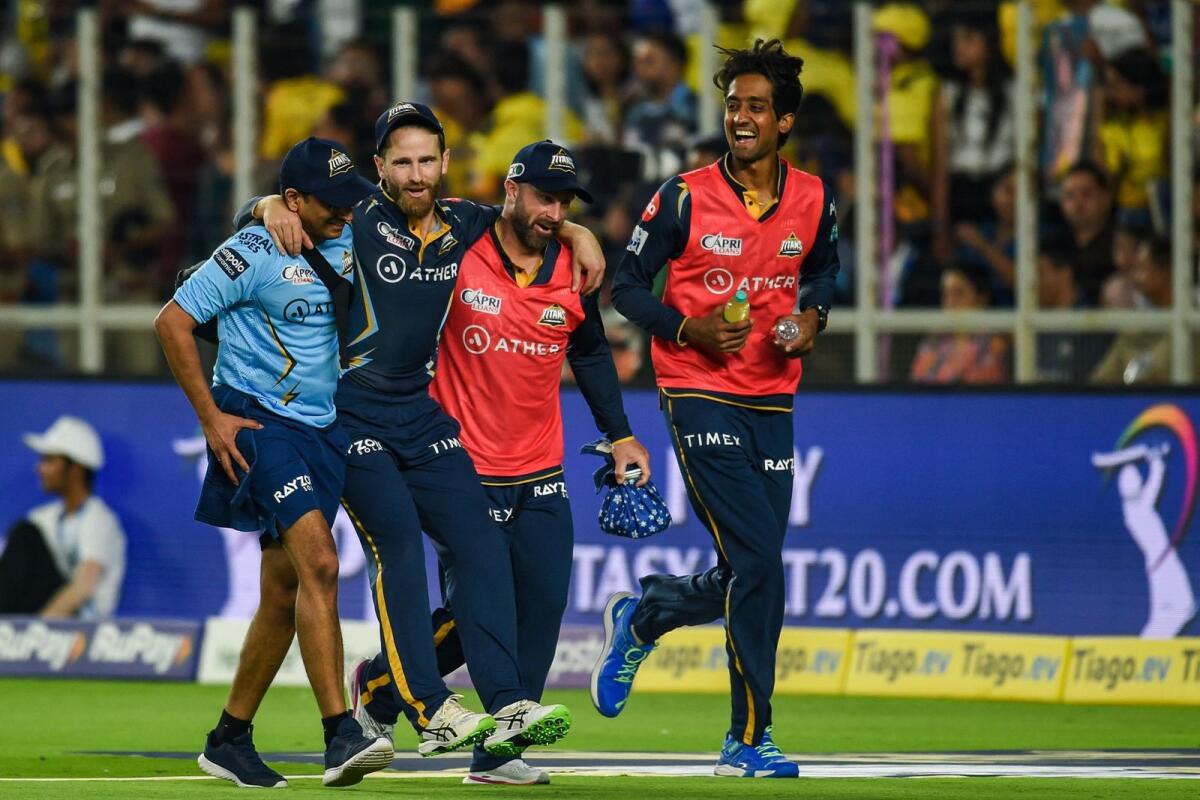 Kane Williamson is helped by teammates after he was injured during the Indian Premier League match between Gujarat Titans and Chennai Super Kings. — AFP