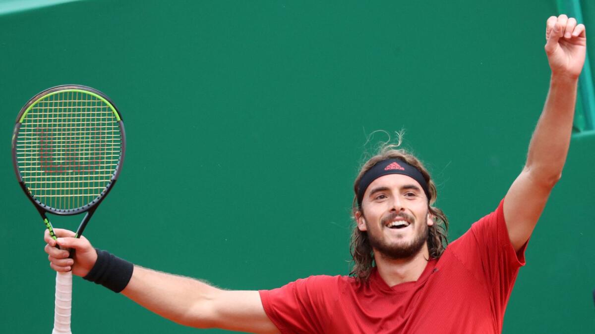 Greece's Stefanos Tsitsipas celebrates after winning the final against Russia's Andrey Rublev on day nine of the Monte-Carlo ATP Masters. — AFP