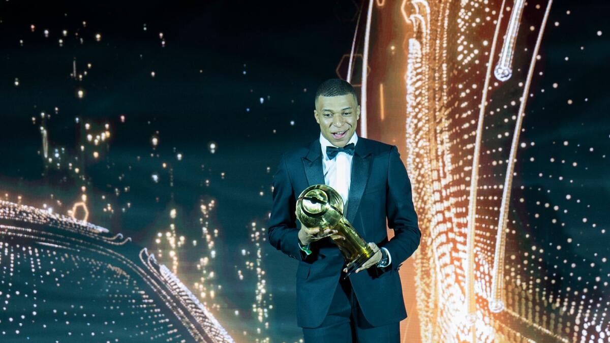 Kylian Mbappe receives the best men's player of the year award. (Photo by Shihab)