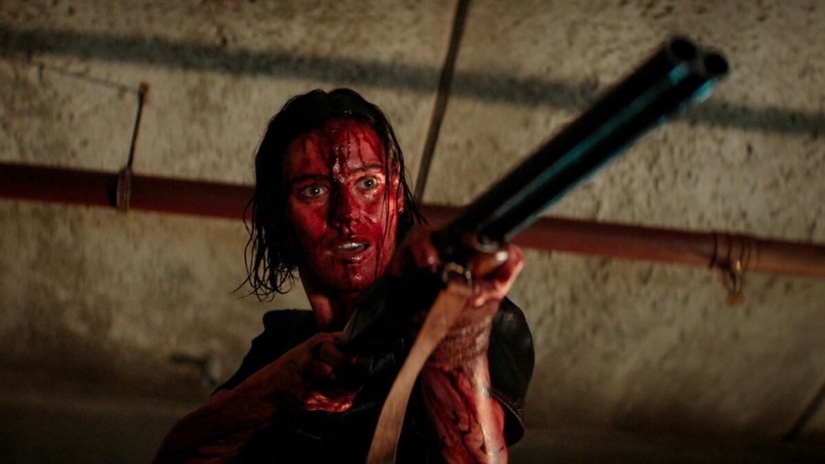This image released by Warner Bros. Pictures shows Lily Sullivan in a scene from 'Evil Dead Rise' (Photo: AP)