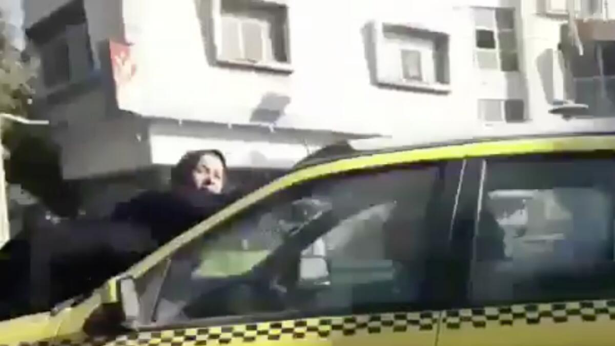 Video: Man drives car around with wife tied to bonnet as punishment