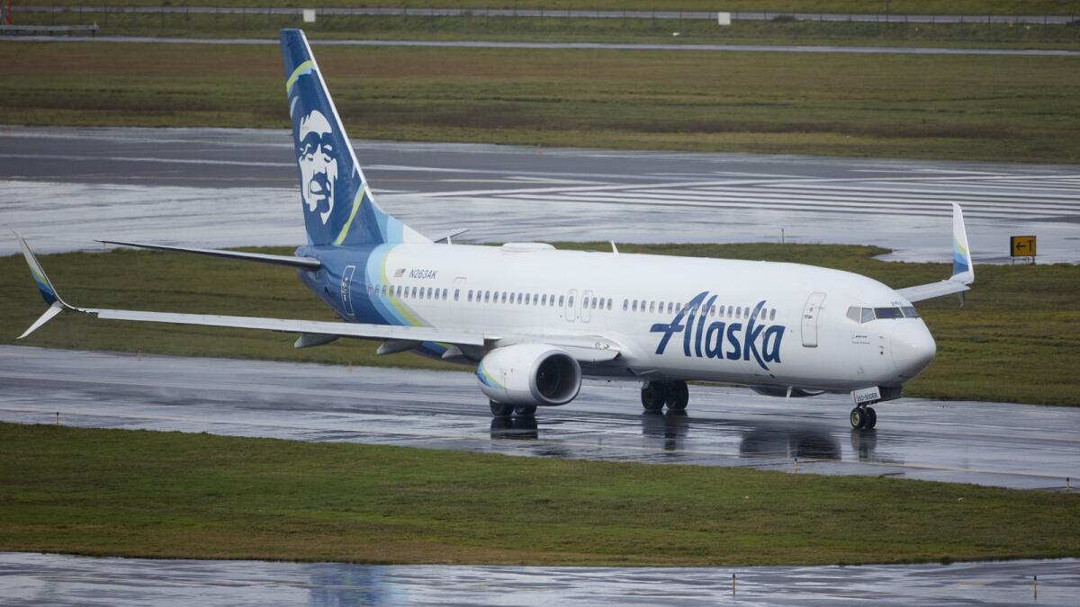 Alaska Airlines flight 1276, a Boeing 737-900, taxis before takeoff from Portland International Airport in Portland. — AP