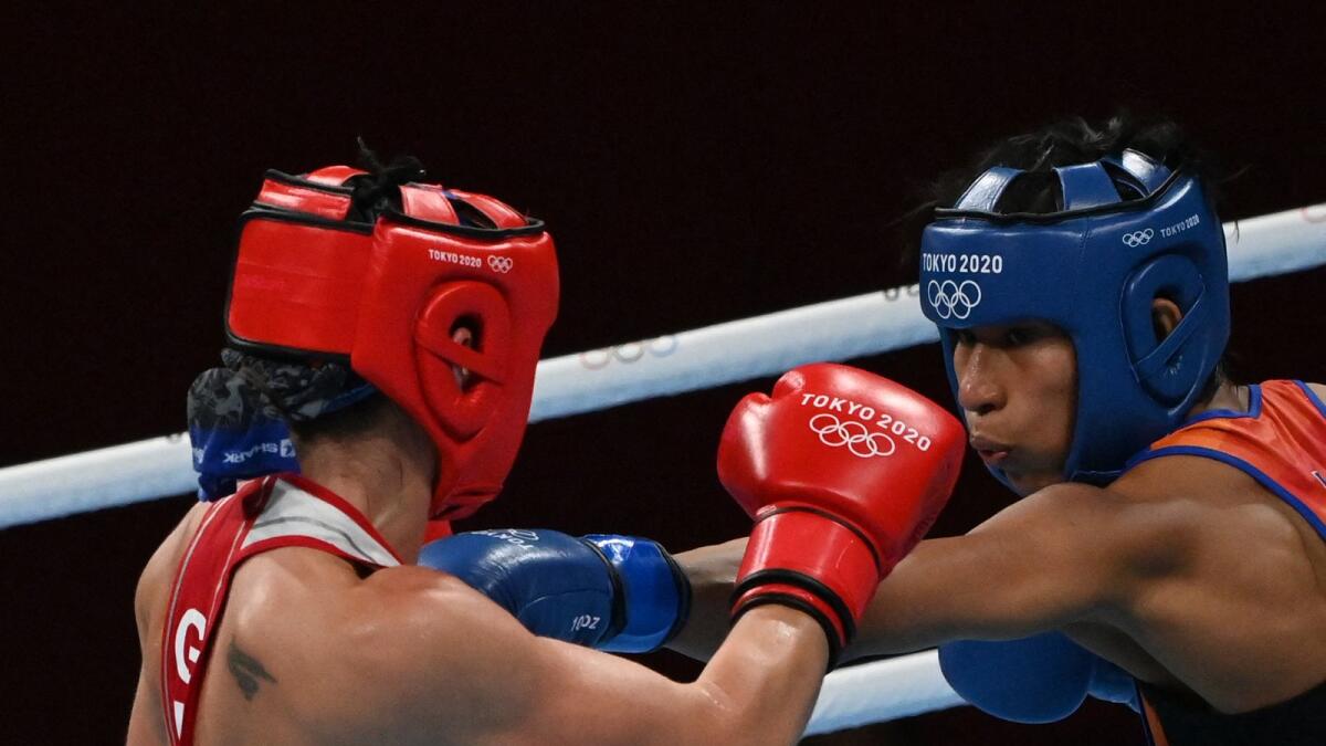 Germany's Nadine Apetz (left) and India's Lovlina Borgohain fight during their women's 69kg match at the Tokyo Olympics on Tuesday. (AFP)