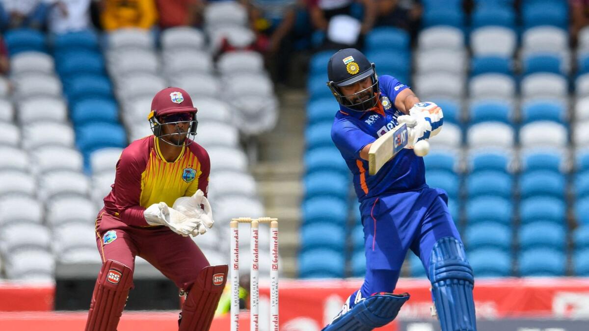 Rohit Sharma (right) plays a shot as Nicholas Pooran looks on during the 1st T20I on Friday. — AFP