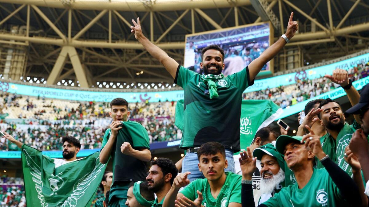 Saudi Arabia fans celebrate after their team's win against Argentina. –Reuters
