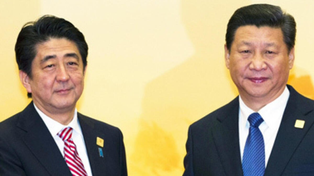 Japan PM Abe meets China’s Xi in Indonesia