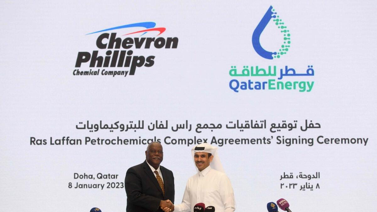 Saad Sherida al-Kaabi (right), Qatar's energy minister and CEO of QatarEnergy, and Bruce Chinn, CEO of Chevron Phillips Chemical company, attend a signing ceremony at the QatarEnergy headquarters in Qatar's capital Doha on January 8, 2023. Qatar signed a $6 billion deal with Chevron Phillips Chemical to build a plant including the biggest ethane cracker in the Middle East, converting natural gas into polyethylene and other plastics. — AFP