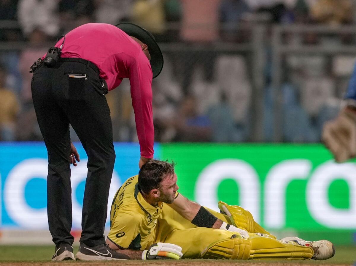 Australia's Glenn Maxwell reacts in pain after an injury during the ICC Men's Cricket World Cup 2023 match against Afghanistan. Photo: PTI