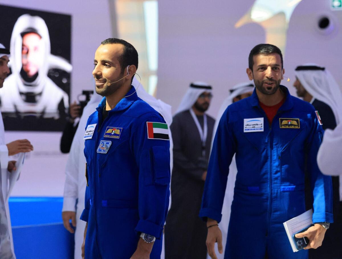 UAE astronauts Sultan AlNeyadi (R) and Hazza Al Mansoori, arrive to give a press conference at the Museum of the Future in the Gulf emirate of Dubai, on February 2, 2023. Photo: AFP
