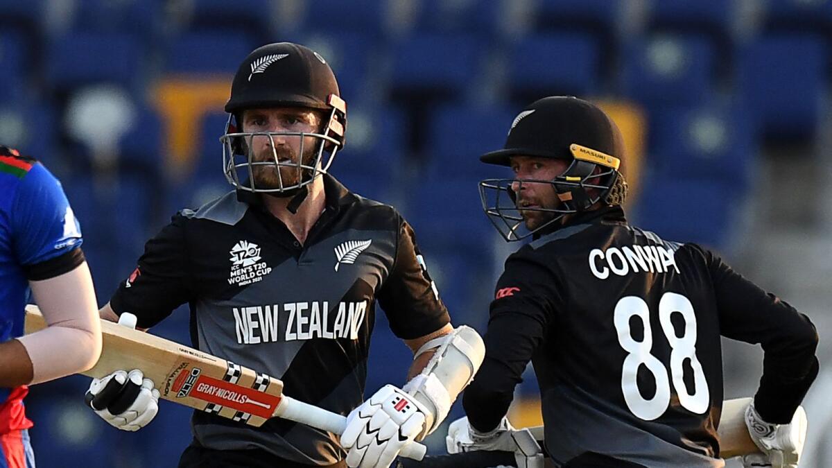 New Zealand's Devon Conway (right) and teammate captain Kane Williamson during the match against Afghanistan. New Zealand will play England in the first semifinal, while Pakistan will face Australia in the second semifinal. (AFP)