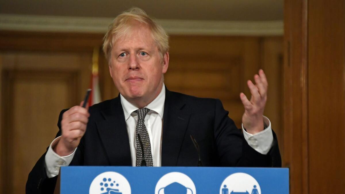 Britain's Prime Minister Boris Johnson gestures as he speaks during a press conference where he is expected to announce new restrictions to help combat the coronavirus disease (COVID-19) outbreak, at 10 Downing Street in London, Britain October 31, 2020. Alberto Pezzali/Pool via REUTERS