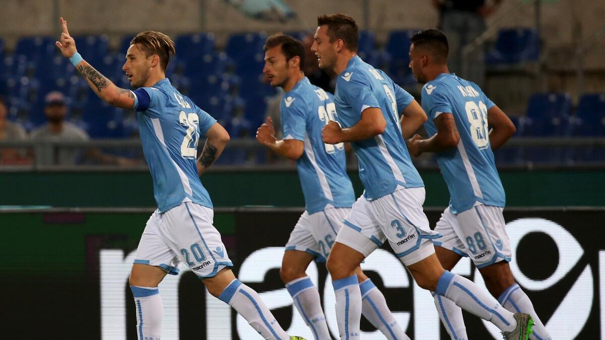 Lazio’s Lucas Biglia (left) celebrates after scoring against Bologna. 