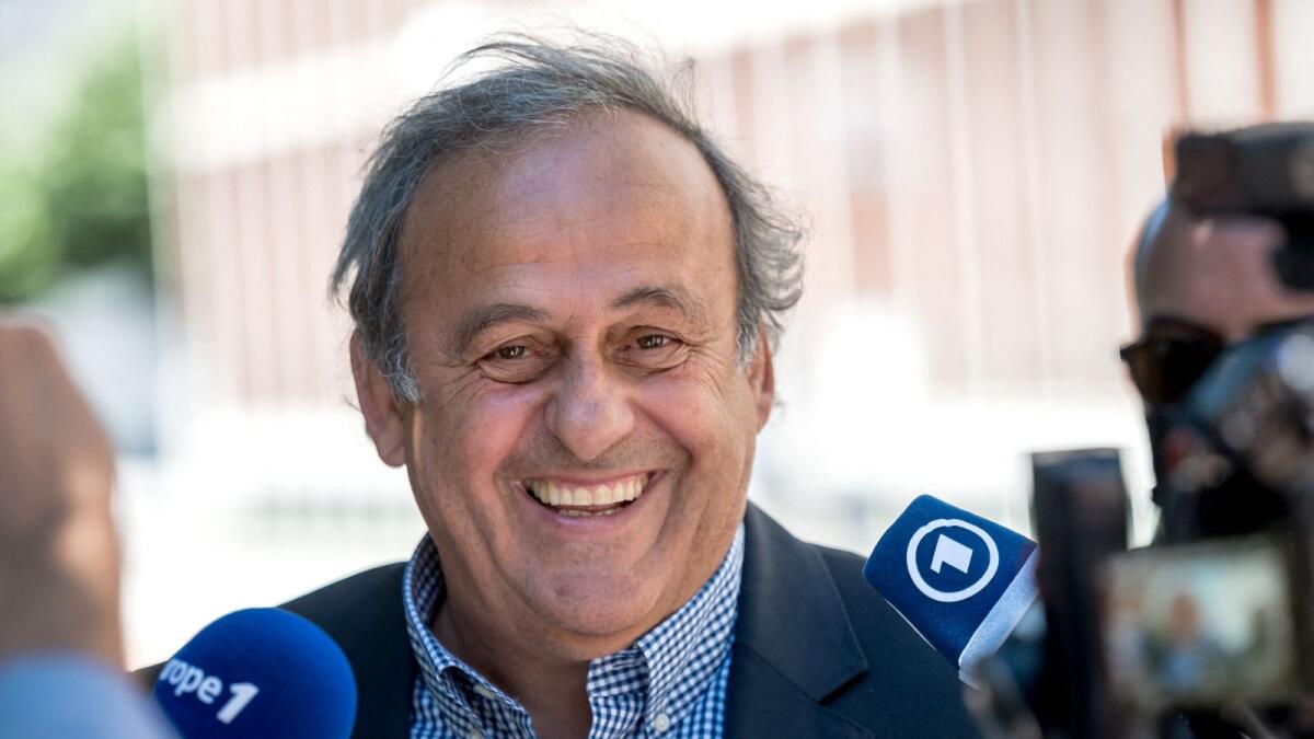 Former Uefa president Michel Platini talks to journalists after the verdict of his trial over a suspected fraudulent payment, at Switzerland's Federal Criminal Court, on Friday. — AFP