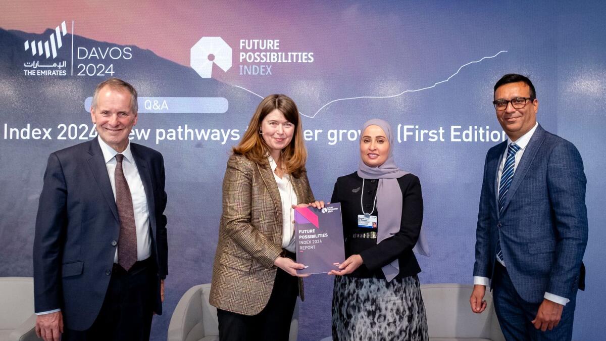 Ohood bint Khalfan Al Roumi receives a copy of the Future Possibilities Index report. — Supplied photo
