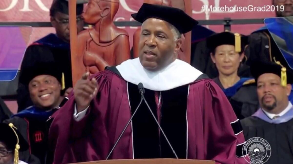 Video: Billionaire surprises 400 students by paying off debts on graduation day 