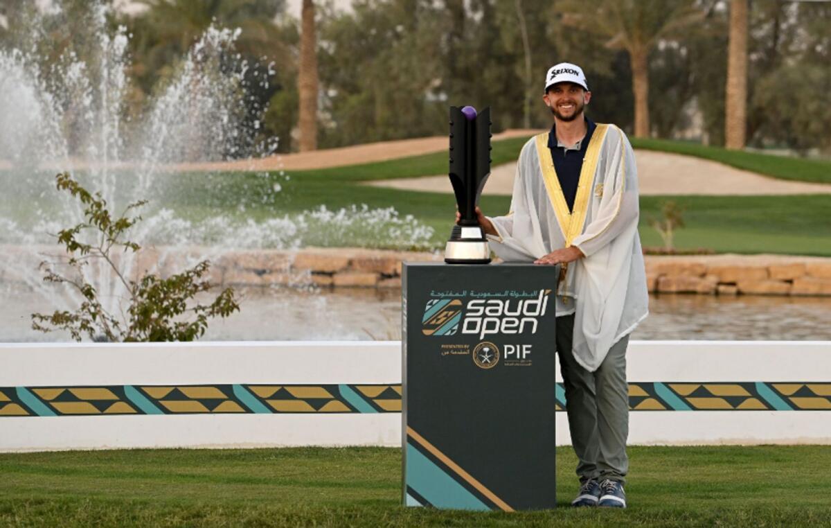 John Catlin poses with the trophy after winning the $1 million Saudi Open on the Asian Tour on Saturday. - Photo Asian Tour