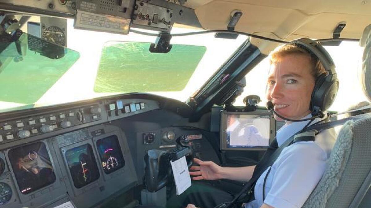PSA pilot Megyn Thompson in the cockpit of a Bombardier CRJ jet near Washington. - Reuters file photo
