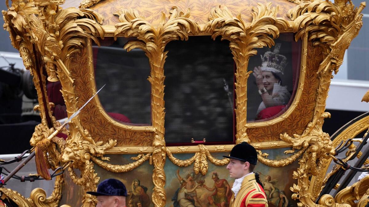 An hologram of Britain's Queen Elizabeth II is projected on the Gold State Coach. Photo: AFP