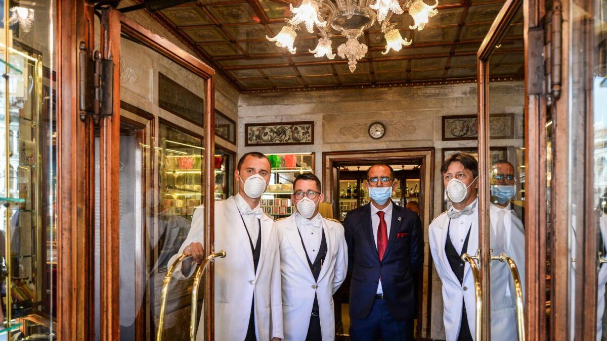 Employees wait for customers at the 18th Century Cafe Florian on St. Mark's Square in Venice, which reopens after being closed for three months during the Covid lockdown.