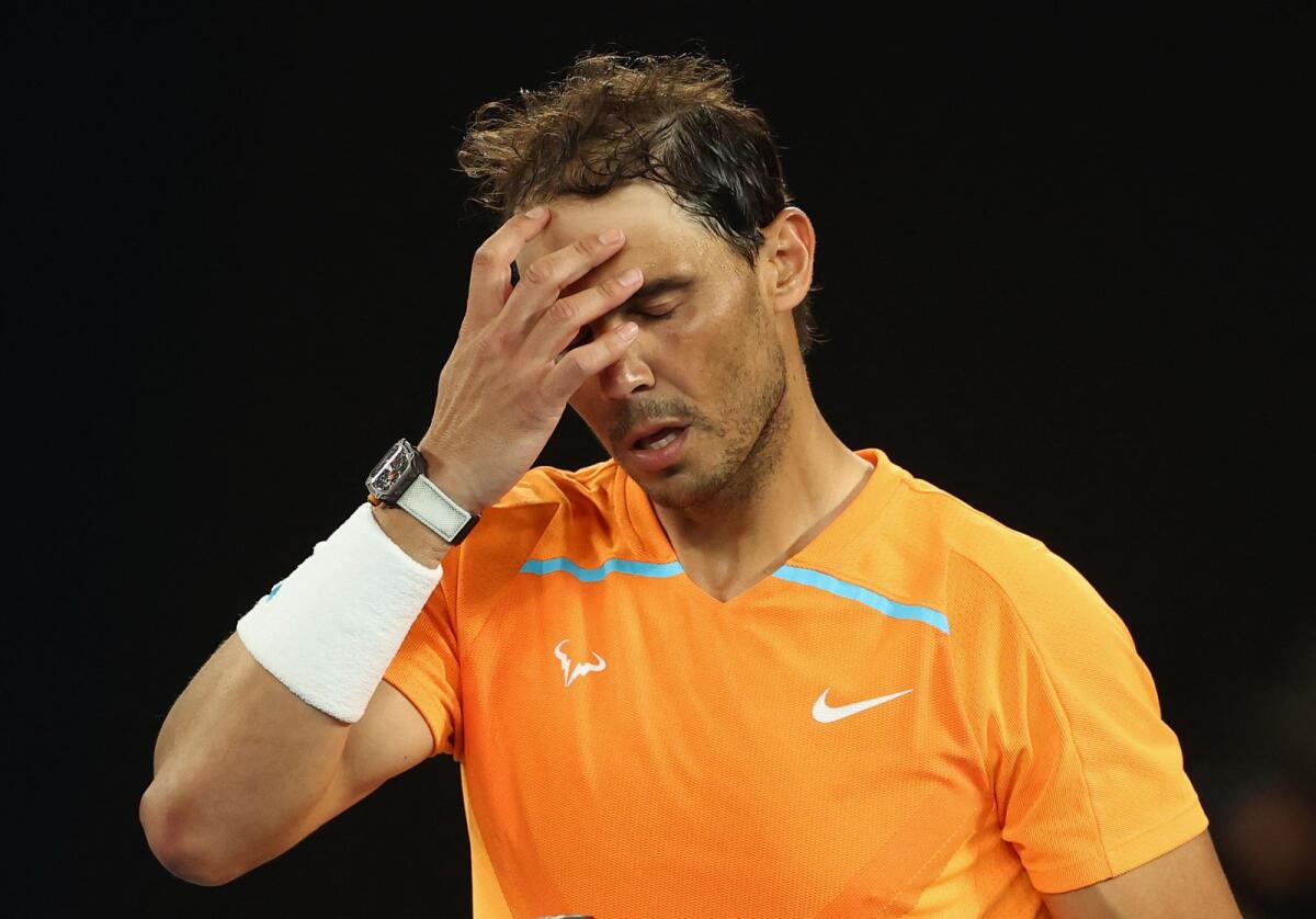 Rafael Nadal looks dejected after losing his second round match against Mackenzie Mcdonald. — Reuters