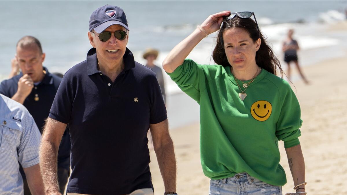 President Joe Biden walks on the beach with daughter Ashley Biden in Rehoboth Beach, Delaware, on June 20, 2022.  — AP file