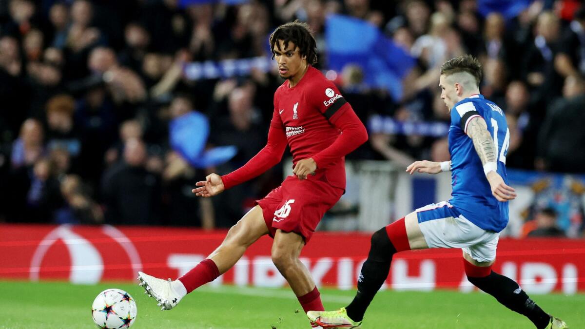 Liverpool's Trent Alexander-Arnold (left) and Rangers' Ryan Kent during the game at Anfield. — Reuters