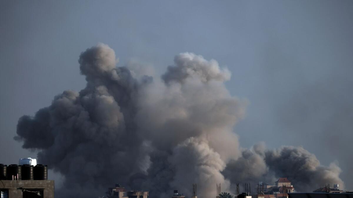 Smoke rises following Israeli bombardments in Khan Younis. — AP