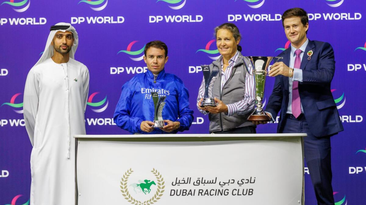 Mickael Barzalnoa, assistant trainer Sophie Chretien and representatives of Godolphin and race sponsor DP World GCC during the presentation ceremony. - Photo by DRC