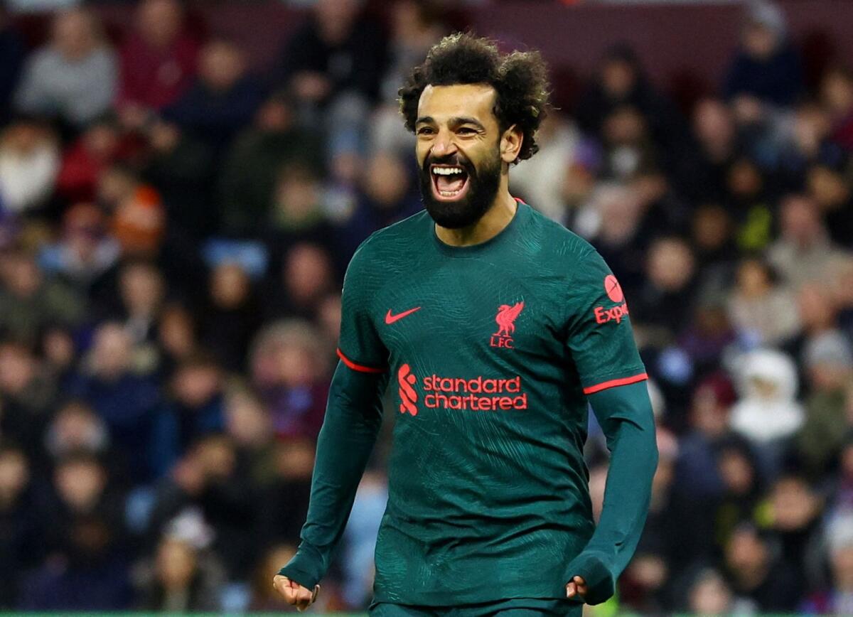 Liverpool's Mohamed Salah celebrates scoring their first goal. — Reuters