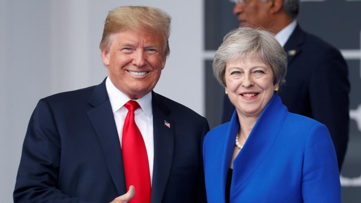 US President Donald Trump and Britains Prime Minister Theresa May pose for a photo.- Reuters
