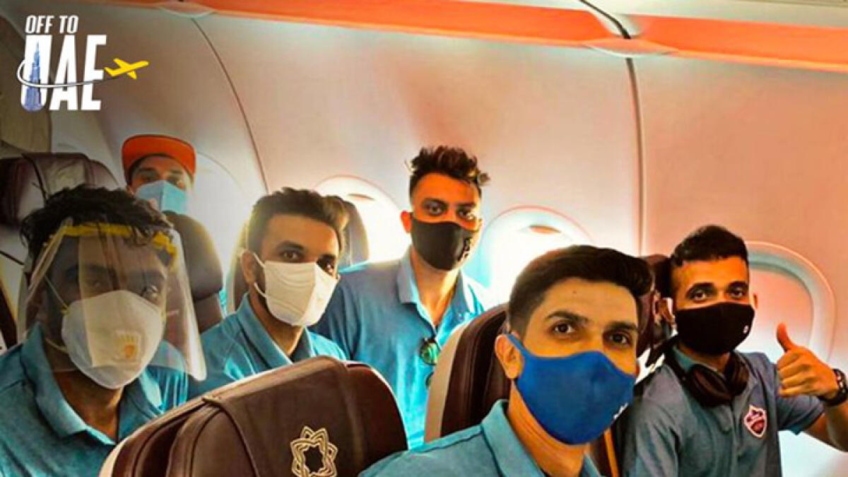 Delhi Capitals players pose for a picture from inside the plane bound for the UAE. -- Delhi Capitals Twitter handle