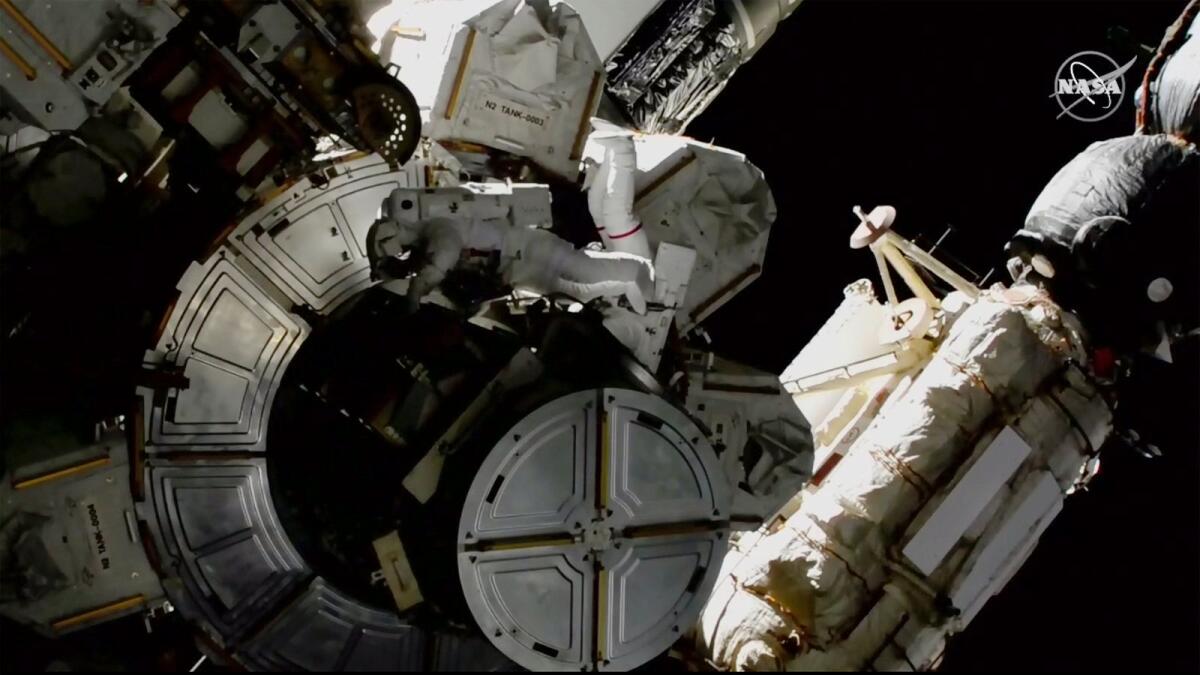 Nasa astronauts Victor Glover and Mike Hopkins on a spacewalk outside the International Space Station on Saturday.