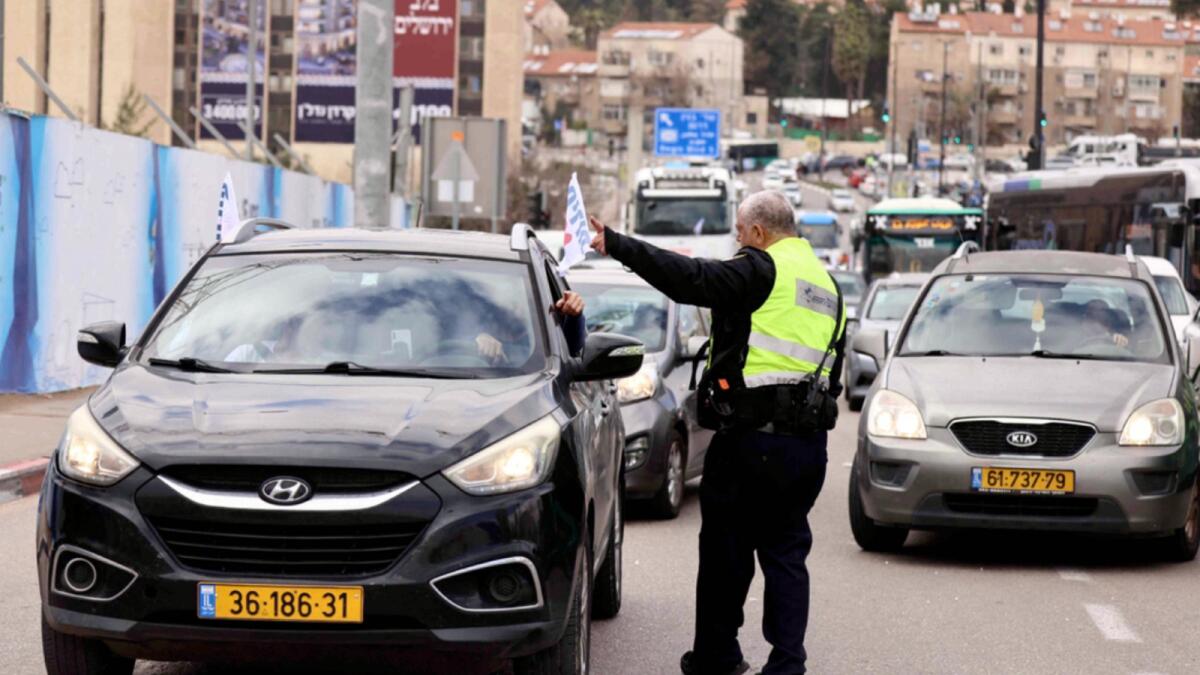 Israeli vehicles take part in a Canada-style protest convoy against Covid regulations, in Jerusalem. — AFP