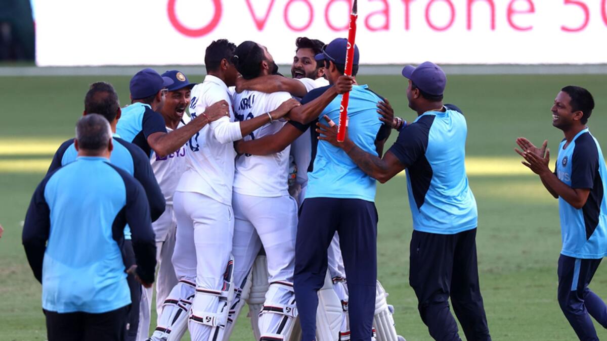 Indian players celebrate their thrilling three-wicket win over Australia in the fourth Test match against Australia at The Gabba in Brisbane. — AFP