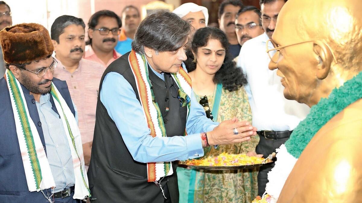Indian parliamentarian Shashi Tharoor pays floral tribute to Mahatma Gandhi during his visit to the India Social and Cultural Centre in Abu Dhabi.-Supplied photo