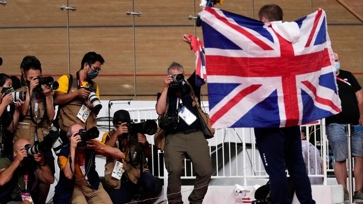Jason Kenny of Team Great Britain celebrates after winning the gold medal during the track cycling men's keirin race at the 2020 Summer Olympics. — AP