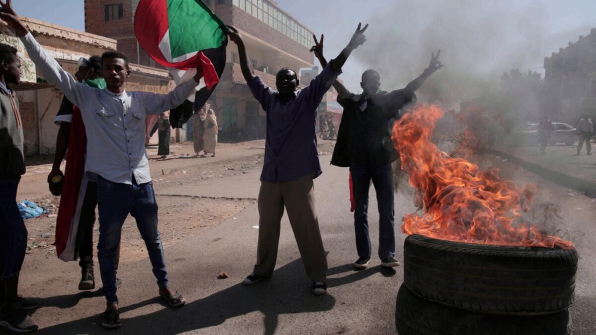 People chant slogans during a protest to denounce the October military coup, in Khartoum. — AP