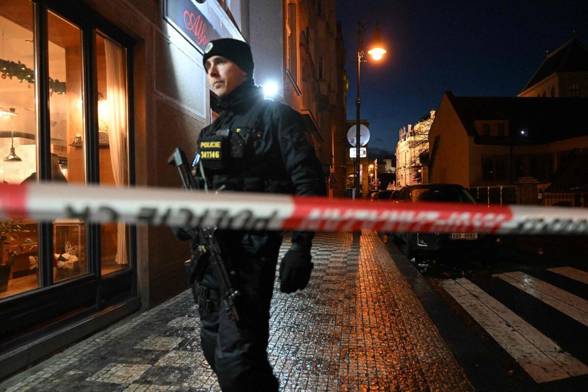 A police officer secures the area near the Charles University in Prague on Thursday. Photo: AFP