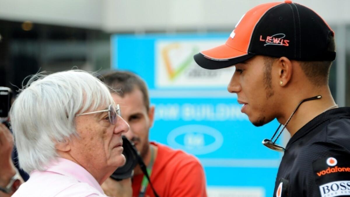 Lewis Hamilton (right) with former F1 supremo Bernie Ecclestone. - AFP file