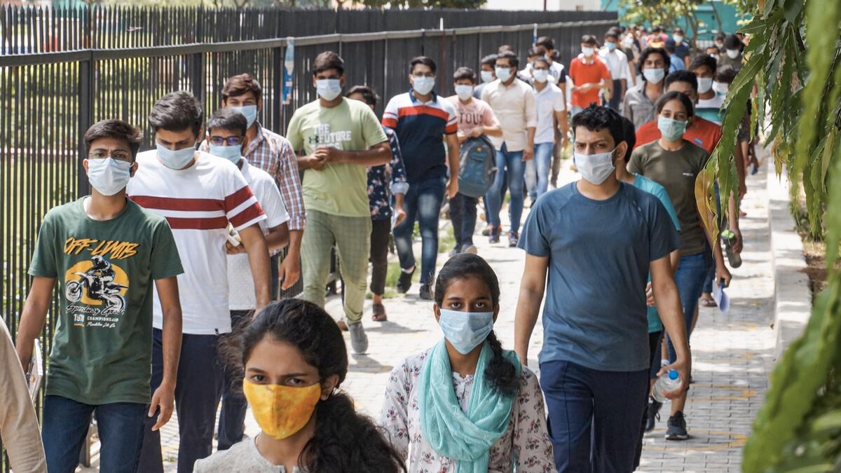 Students leave an examination centre after appearing for the JEE 2020 entrance papers, amid the ongoing coronavirus pandemic, in Gurugram, India. Photo: PTI