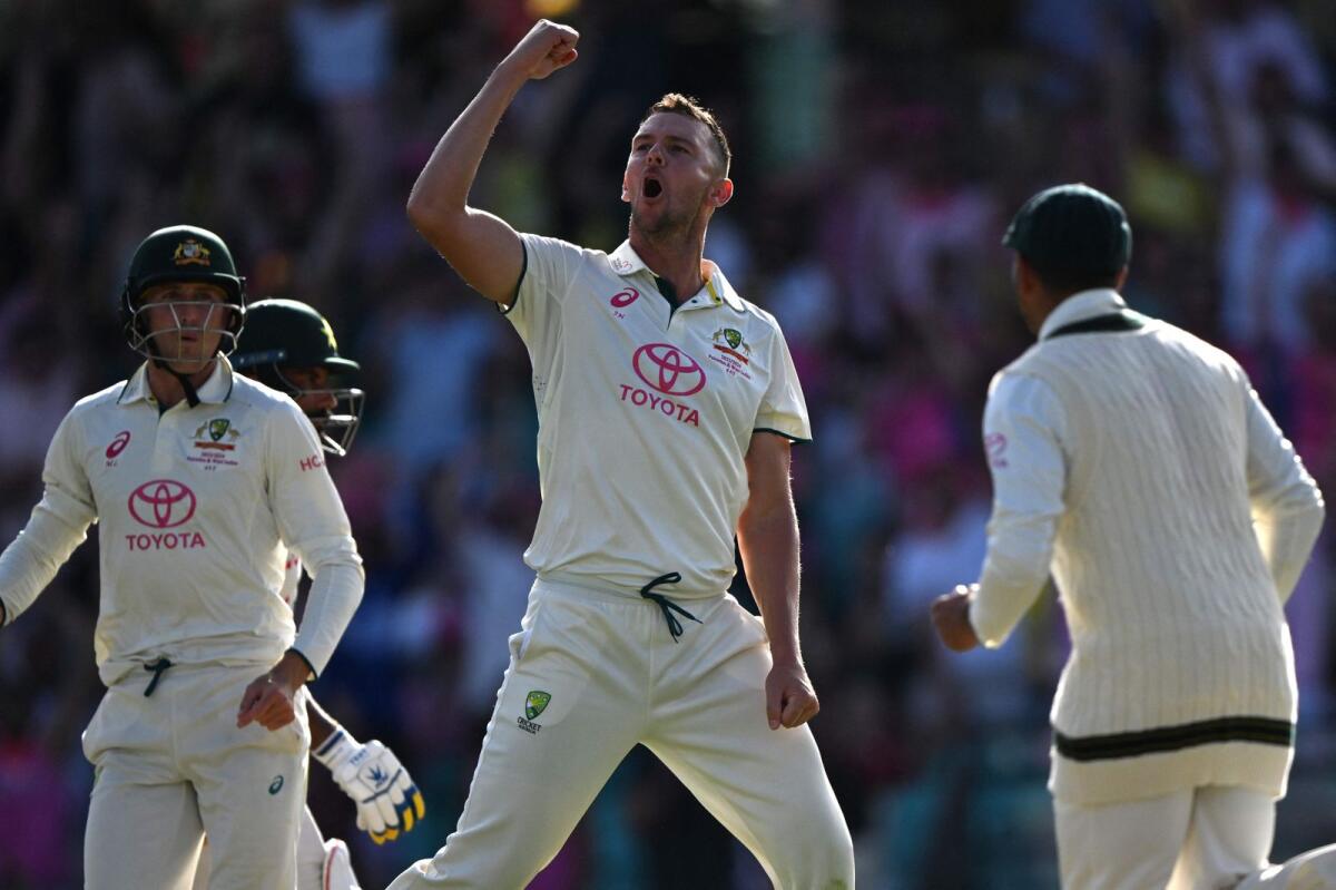 Australia’s Josh Hazlewood (C) celebrates taking the wicket of Pakistan’s Sajid Khan. - AFP