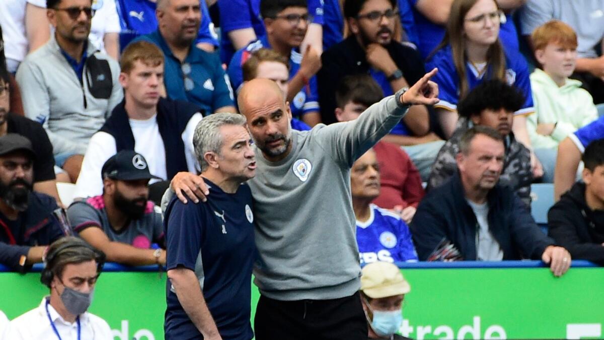 Manchester City manager Pep Guardiola gives instructions to his assistant coach Juan Manuel Lillo. — Reuters