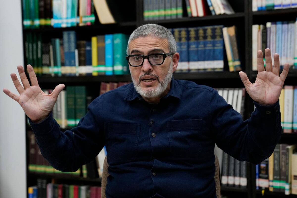 Doctor Ghassan Abu Sitta, a Palestinian-British plastic surgeon specialising in conflict medicine, speaks during an interview with The Associated Press at the Institute for Palestine Studies in Beirut, Lebanon, on December 9, 2023.  — AP