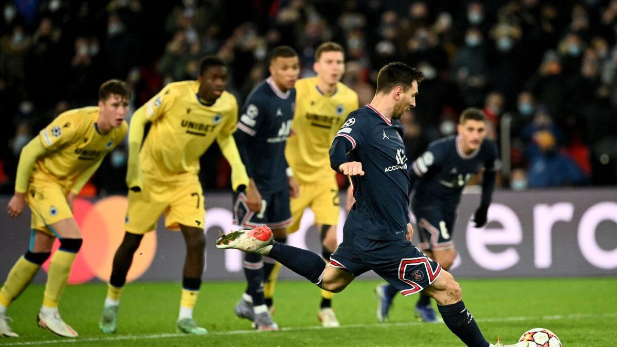 Paris Saint-Germain's Lionel Messi scores from a penalty kick against Club Brugge at the Parc des Princes Stadium in Paris on Tuesday night. — AFP