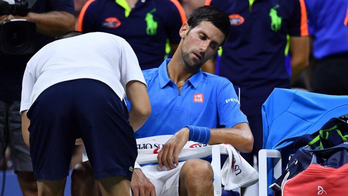 Djokovic plays down arm injury