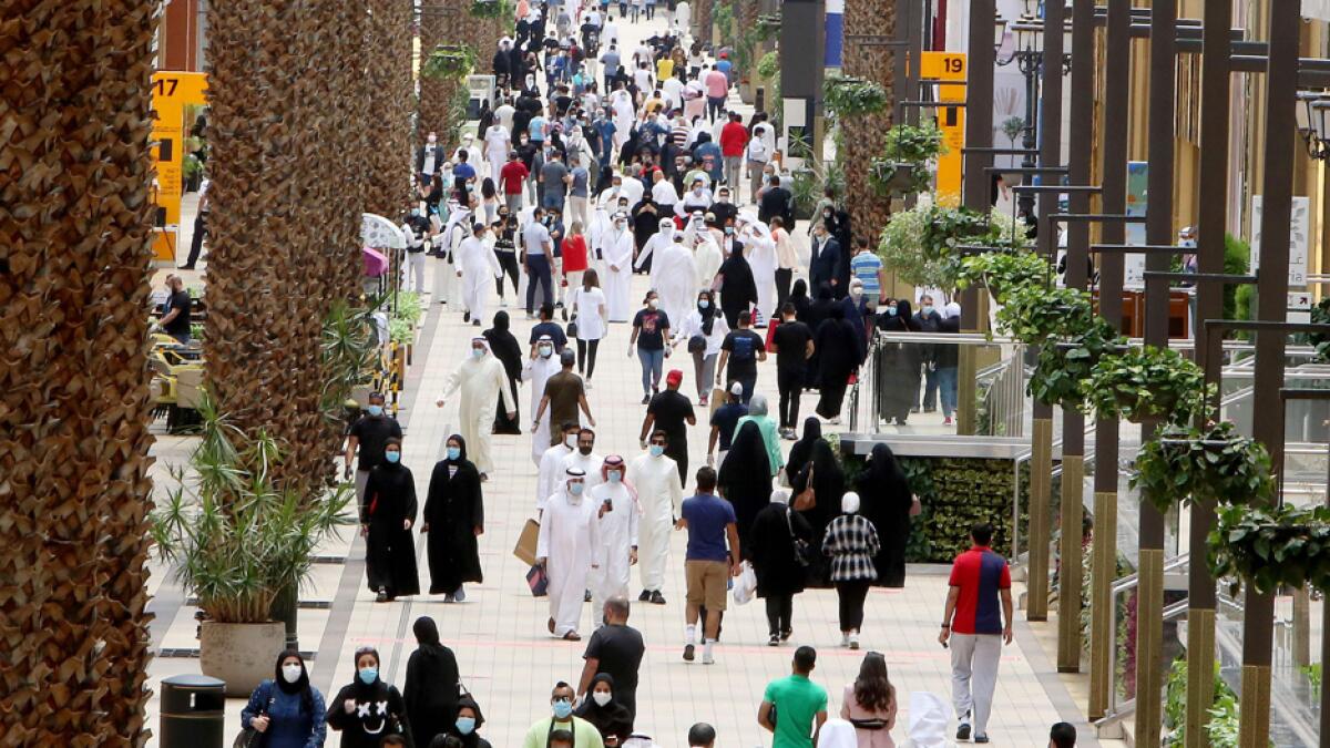 Kuwaitis wearing face masks walk inside the re-opened Avenues Mall, the country's largest shopping centre, on June 30, 2020 in Kuwait City after almost a four-months shutdown to prevent the spread of the coronavirus in the country. Photo: AFP