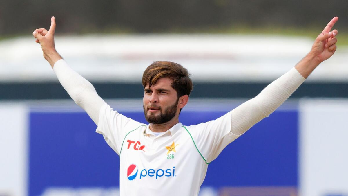 Pakistan's Shaheen Shah Afridi celebrates the wicket of Sri Lanka's Dimuth Karunarathne during the first day of the first Test in Galle on Saturday. — AP