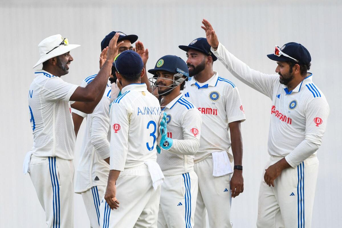Ravichandran Ashwin (L), Mohammed Siraj (2R), Ishan Kishan (3R) and Rohit Sharma (R) of India celebrate during the India vs England Test series. - AFP File