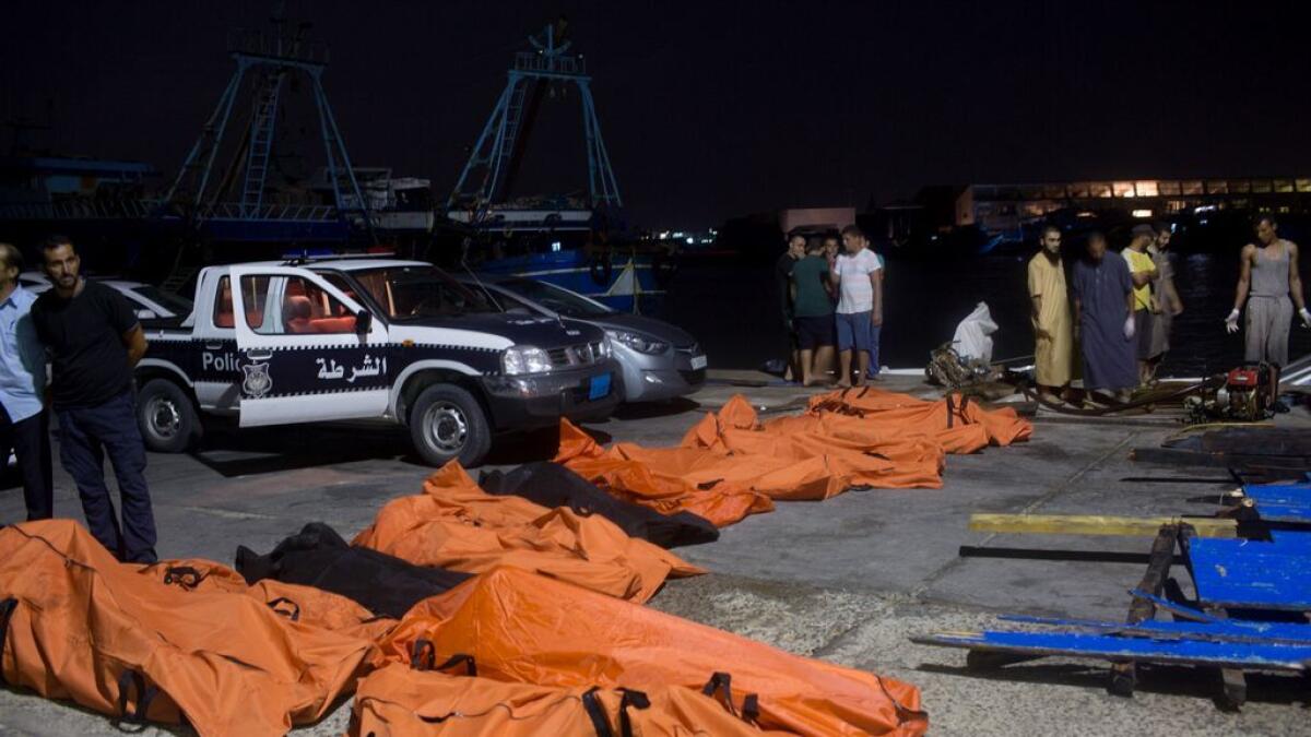 Bodies of migrants who drowned off the coast when their boat sank are collected in Zuwara, Libya.